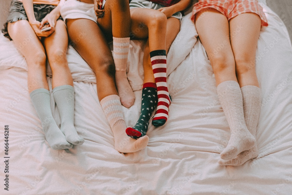 Teenage sleepover party aesthetic, girls wearing colorful socks Stock Photo  | Adobe Stock