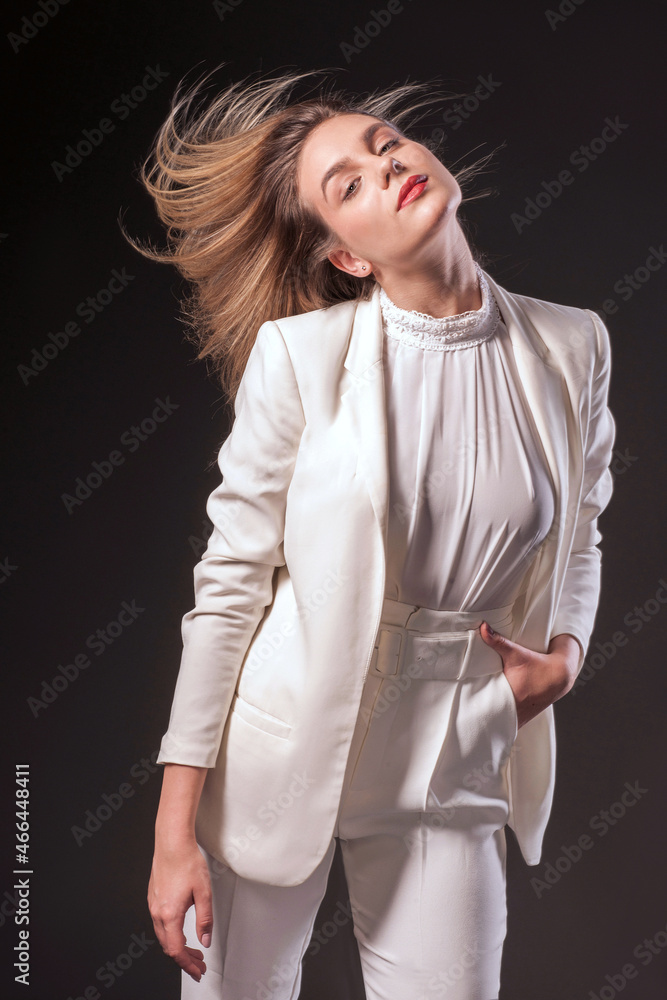 Fashion studio portrait of a beautiful woman with a long brown hair ...