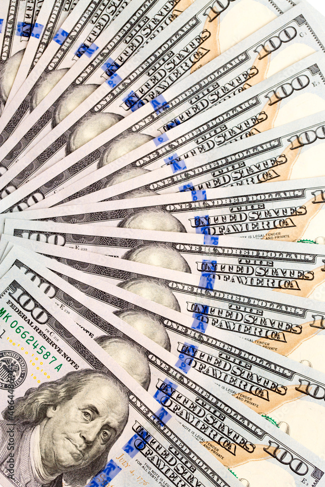 One Hundred Dollar Banknotes are creatively laid out. Money banknotes of US dollars, a lot of different money. Buy printing, banking. Cash income, wealth and financial independence. One Hundred Dollar Banknotes are creatively laid out. Money banknotes of US dollars, a lot of different money. Buy printing, banking. Cash income, wealth and financial independence.