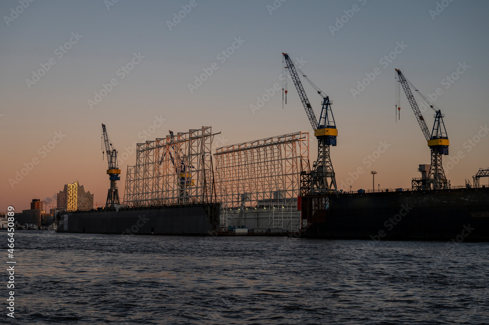 Empty dock in the harbour of Hamburg with the Elbphilharmonie in the evening