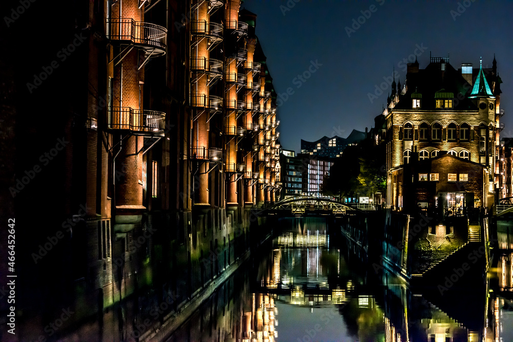 The illuminated Speicherstadt in Hamburg in the evening