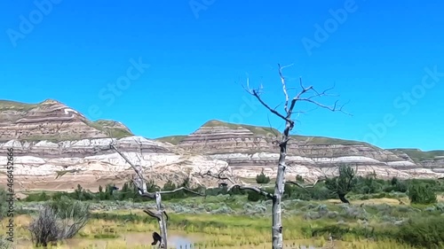 SLOW MOTION - Driving by the mountains in Saskatchewan Alberta Canada on a sunny day well traveling. photo