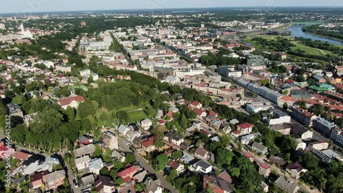 Zaliakalnis private homes and downtown of Kaunas city, aerial fly back view photo