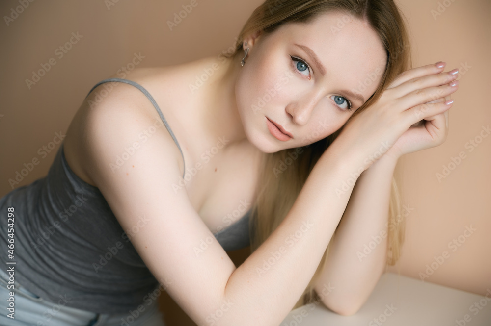 Portrait of a beautiful young woman with blue eyes. Portrait of a beautiful young woman with blue eyes.