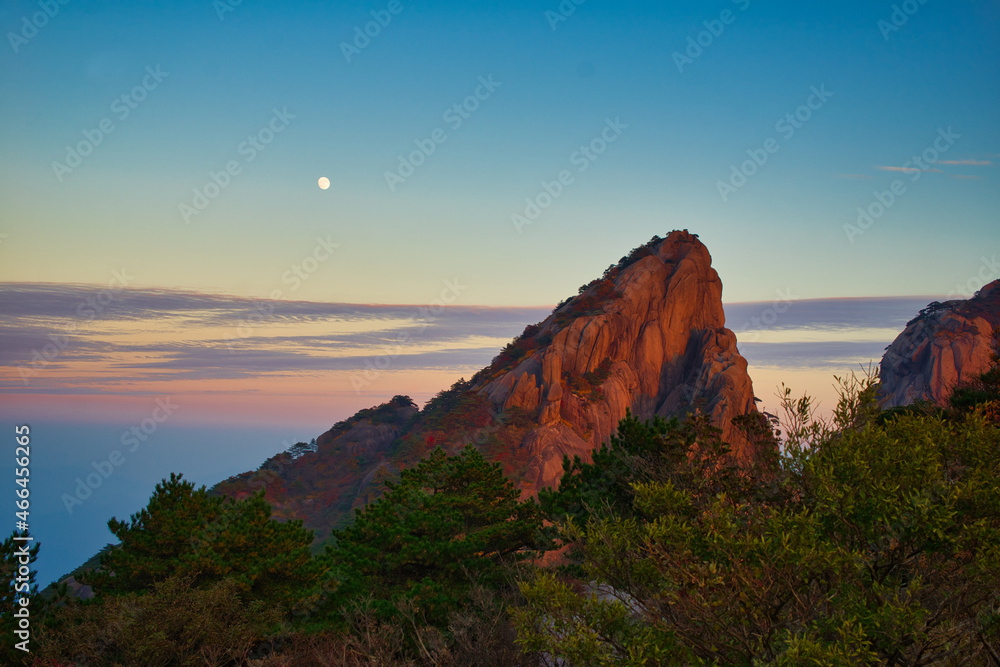 The beautiful and poetic view of Huangshan Mountain at dusk. Landscape of Mount Huangshan (Yellow Mountain). UNESCO World Heritage Site. Anhui Province, China.