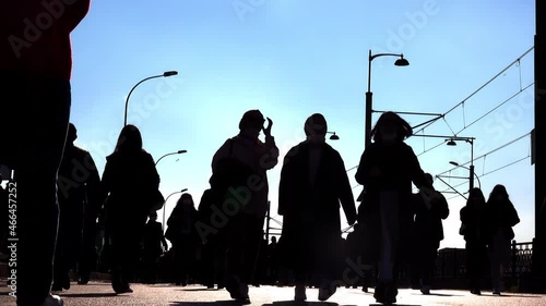 People walking in the big street timelapse. Silhouette of pedestrian crowd walking towards camera. Sunny autumn day.