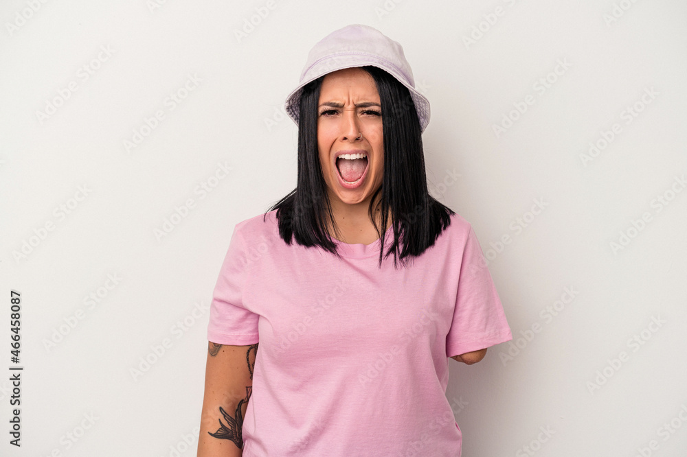 Young caucasian woman with one arm isolated on white background screaming very angry and aggressive. Young caucasian woman with one arm isolated on white background screaming very angry and aggressive.