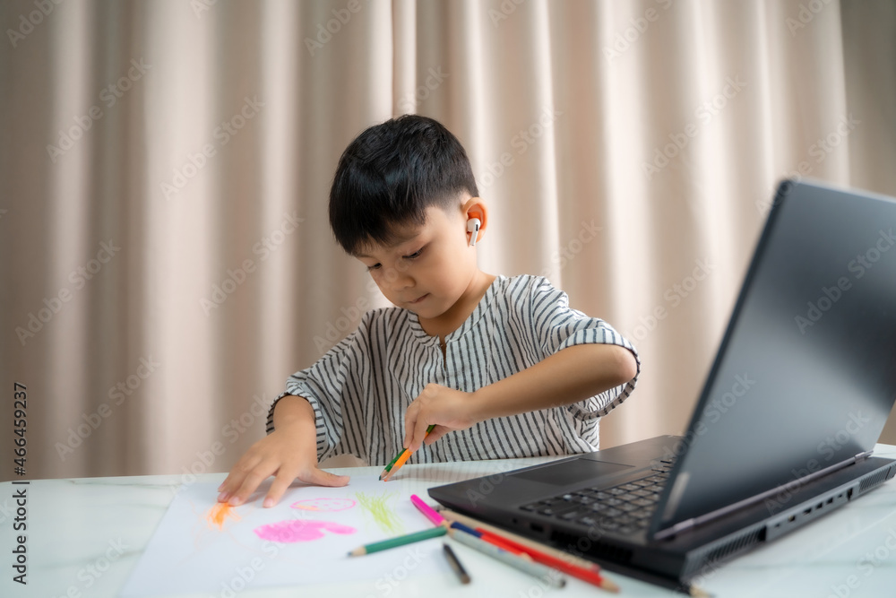 Studying remotely online,Student learning at home,Child is using a laptop and study online at home,Homeschooling,Distance learning. Studying remotely online,Student learning at home,Child is using a laptop and study online at home,Homeschooling,Distance learning.