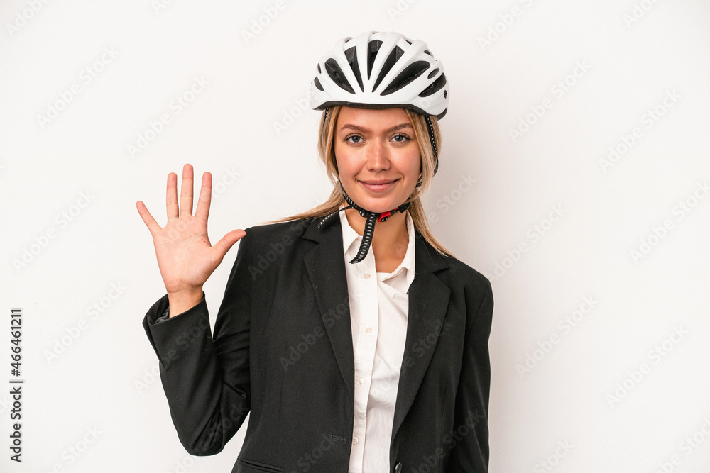 Young caucasian business woman wearing a bike helmet isolated on white background smiling cheerful showing number five with fingers. Young caucasian business woman wearing a bike helmet isolated on white background smiling cheerful showing number five with fingers.