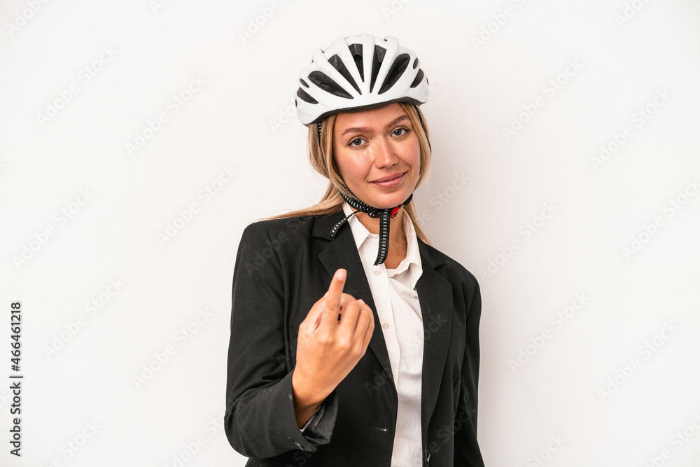 Young caucasian business woman wearing a bike helmet isolated on white background pointing with finger at you as if inviting come closer. Young caucasian business woman wearing a bike helmet isolated on white background pointing with finger at you as if inviting come closer.