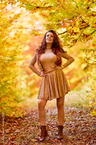 portrait of a beautiful woman in the woods in autumn season © czamfir