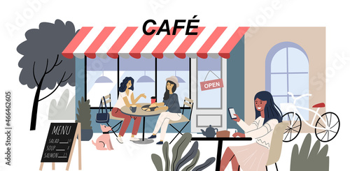 Summer outdoor cafe. People Drink and eating in Street. Girlfriends talking and resting