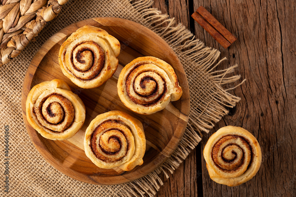 Cinnamon rolls on wooden background. Cinnamon rolls on wooden background.