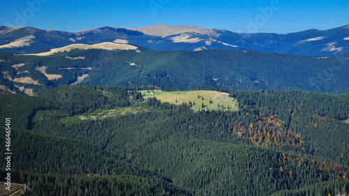 The alpine forested mountainsides of Capatanii Mountains. The mountain peaks are positioned along Latorita Valley. Autumn. Carpathia, Romania.