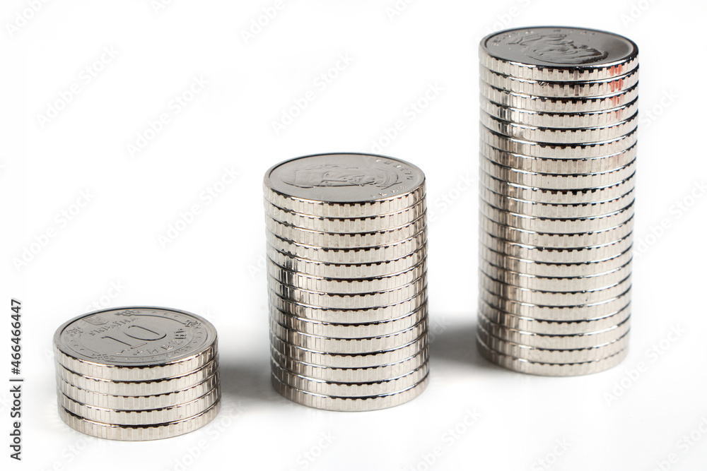 Stack of 10 hryvnia coins, on a white background. Ukrainian coins Stack of 10 hryvnia coins, on a white background. Ukrainian coins