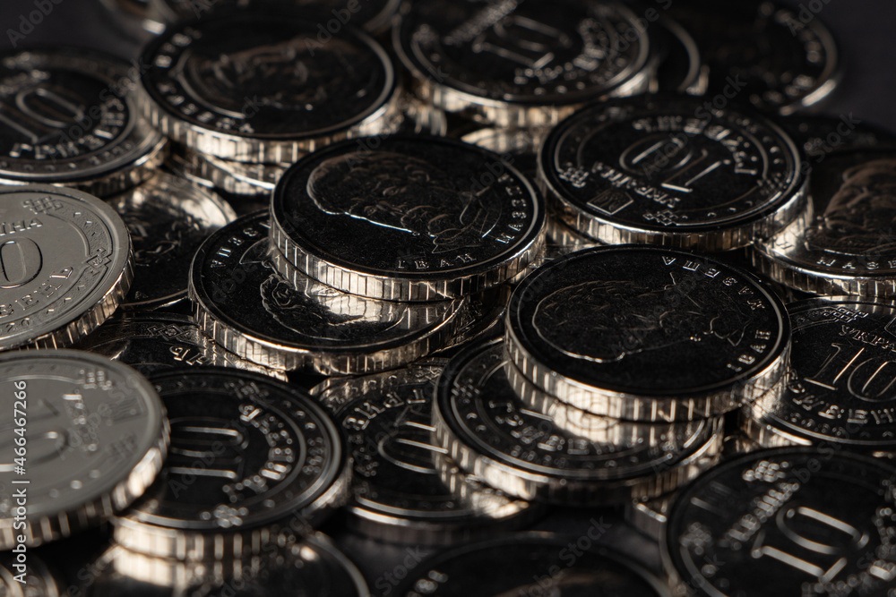 Silver coins background. Ukrainian 10 hryvnias coins. Money and finances. Ukrainian coins. Silver coins background. Ukrainian 10 hryvnias coins. Money and finances. Ukrainian coins.