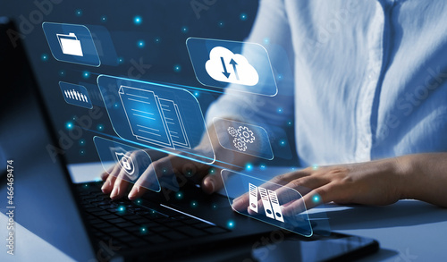 Tableau sur toile Business woman using a laptop with digital graph to document management