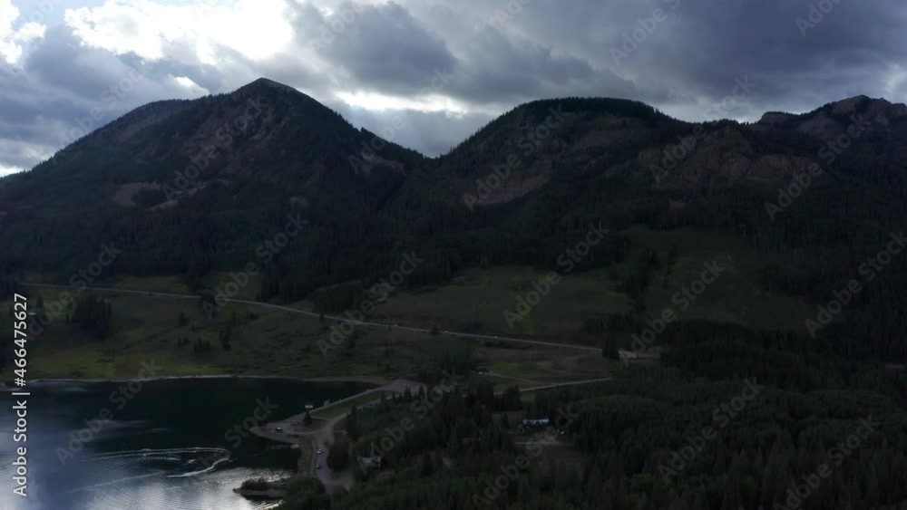 Beautiful flying shot over a lake in the mountains. Beautiful flying shot over a lake in the mountains.