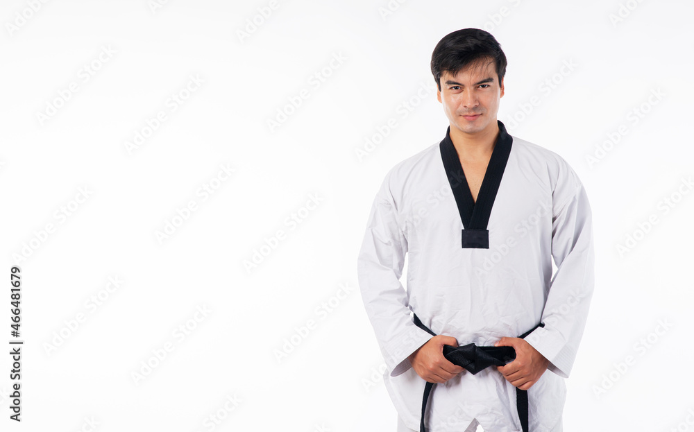 Confidence athlete strong young man wear uniform taekwondo holding black belt in own hand while standing over isolated white background. Activity power tradition Korean concept. Confidence athlete strong young man wear uniform taekwondo holding black belt in own hand while standing over isolated white background. Activity power tradition Korean concept.