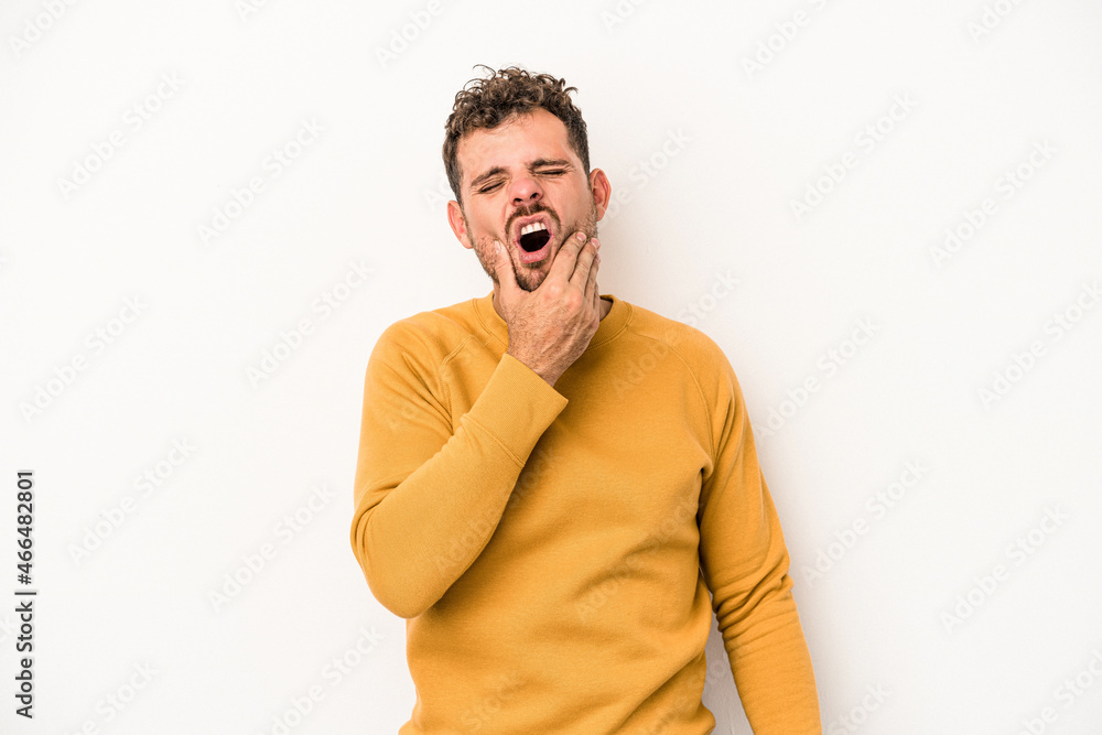 Young caucasian man isolated on white background having a strong teeth pain, molar ache. Young caucasian man isolated on white background having a strong teeth pain, molar ache.