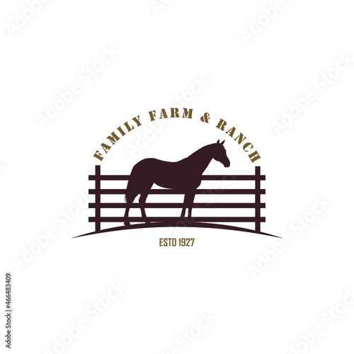 Silhouette Horse behind wooden fence paddock applied for the logo of vintage retro rustic countryside western country farm ranch.
