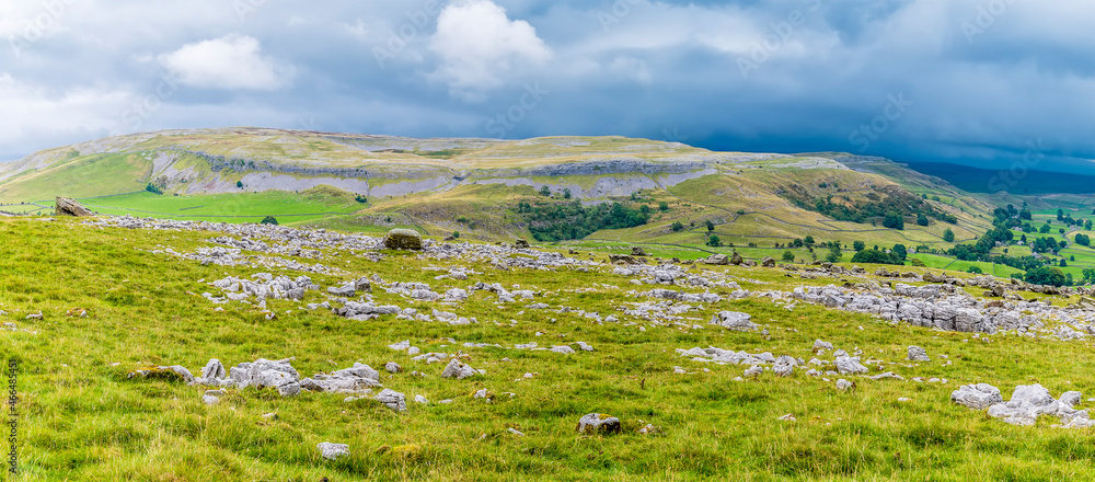 A view across limestone pavement and the southern slopes of Ingleborough, Yorkshire, UK in summertime