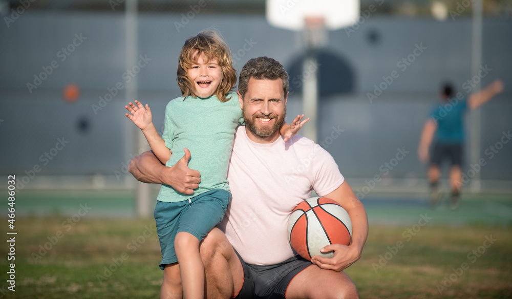 happy fathers day. family portrait. dad and kid boy hold sport ball. child play basketball.