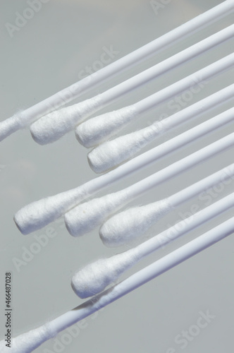 Heap of cotton swabs on a white background  hygienic cosmetic and medical supplies.