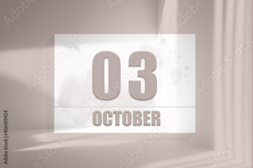 october 03. 03th day of the month, calendar date.White sheet of paper with numbers on minimalistic pink background with window shadows.Autumn month, day of the year concept photo