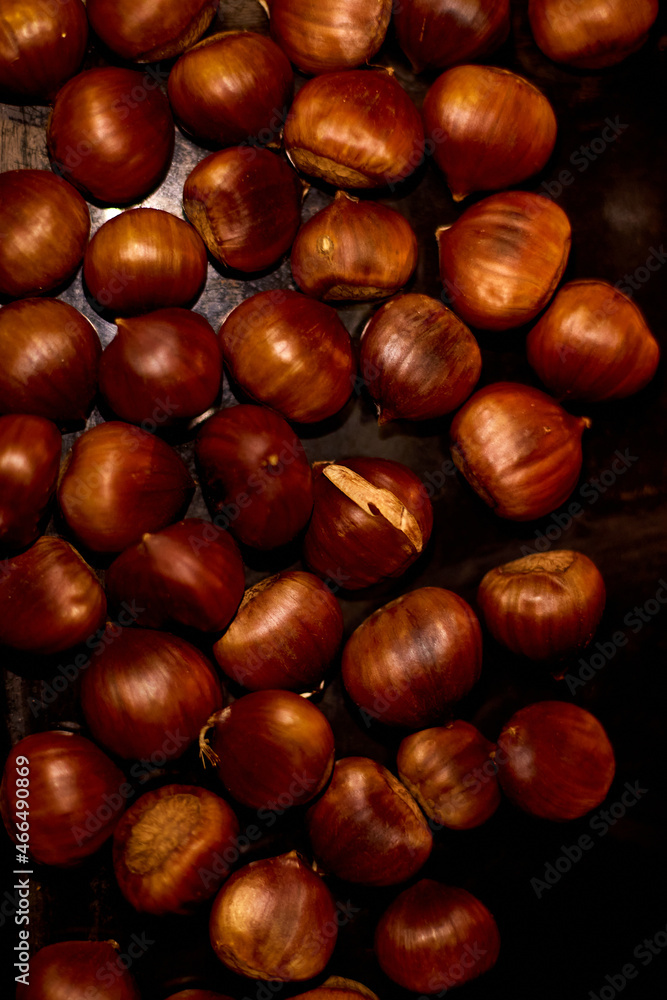 Chestnuts, maroni roasted chestnuts, popular autumn street food in Europe. Chestnuts, maroni roasted chestnuts, popular autumn street food in Europe.