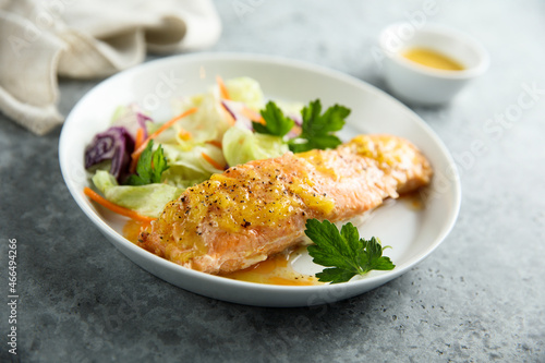 Baked salmon with orange sauce and salad