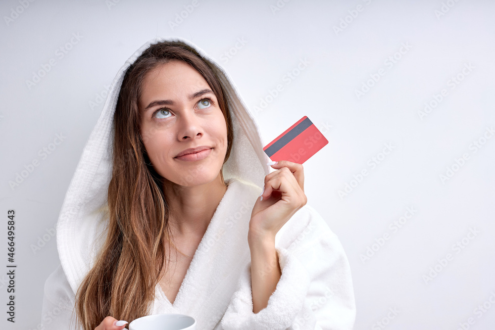 Pretty Female In Bathrobe Stand In Contemplation Looking Up Thinking, Dreamy Lady In Contemplation. Excited Woman Want To Buy Smartphone Pay Credit Card, Online Shopping From Home At Weekends Pretty Female In Bathrobe Stand In Contemplation Looking Up Thinking, Dreamy Lady In Contemplation. Excited Woman Want To Buy Smartphone Pay Credit Card, Online Shopping From Home At Weekends