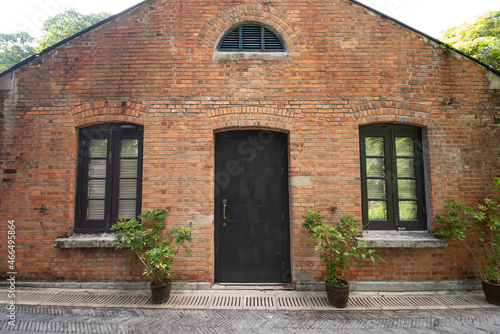Facade and exterior of historical old brick house
