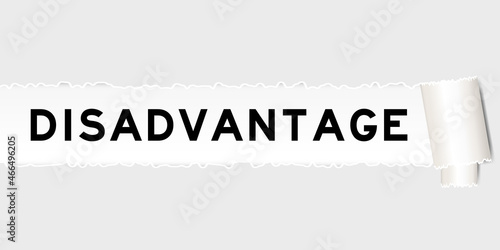 Ripped gray paper background that have word disadvantage under torn part