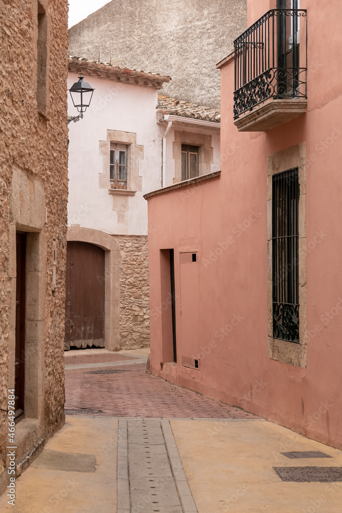 Fototapeta premium old street in begur with pastel colored houses