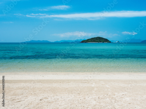 Scenic view of white sand beach and crystal clear turquoise water with Koh Kham island at horizon. Koh Mak Island, Trat , Thailand.