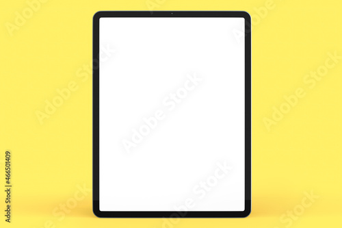 Computer tablet with blue cover isolated on yellow background.
