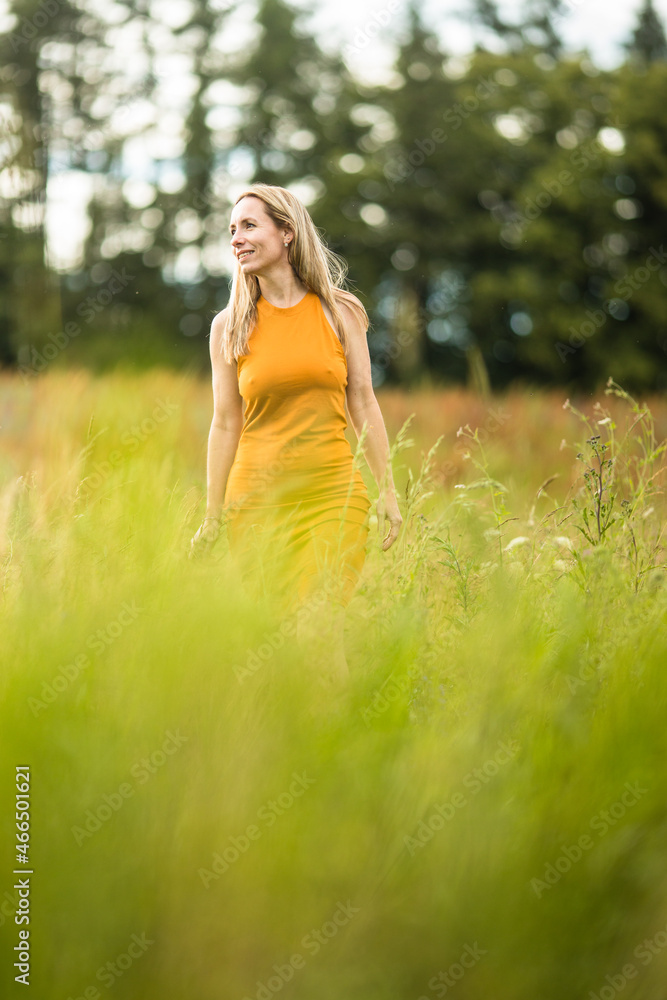 Portrait of a relaxed middle aged woman outdoors, looking happy, enjoying the life Portrait of a relaxed middle aged woman outdoors, looking happy, enjoying the life