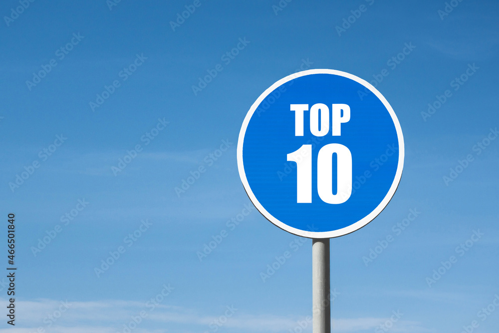 'Top 10' sign in blue round frame on sky background