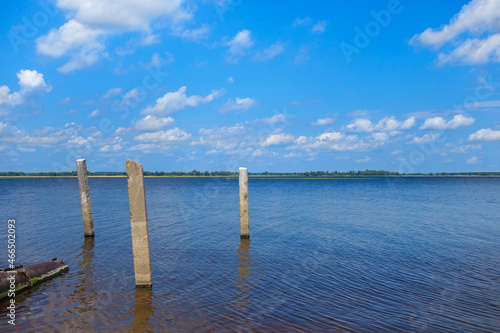 Classic panorama of the Volga River in the Middle Volga region, Russia. On the left side, you can see the remains of the construction of an old boat dock