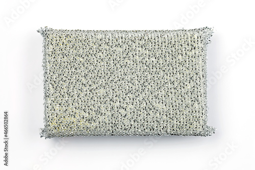 silver kitchen sponge with lurex on a white background top view. Hard sponge for washing dishes. Scraper for cleaning surfaces from grease in the kitchen. Metal sponge for washing dishes