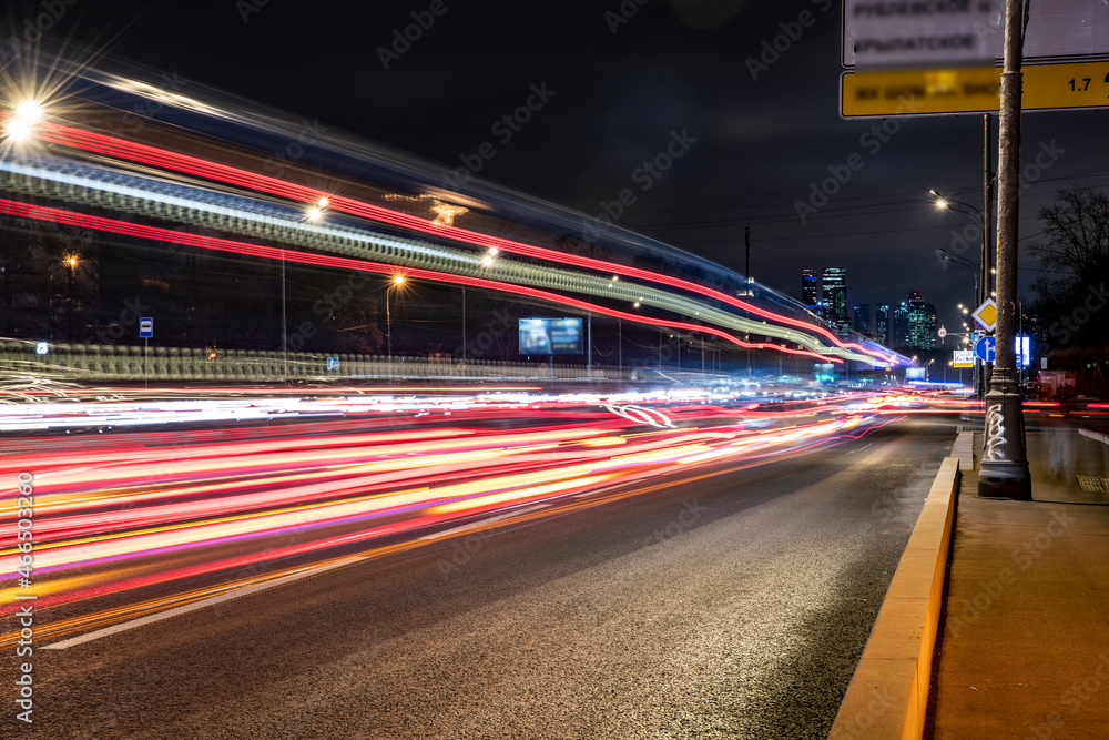 night landscape with a freeway and fast moving cars leaving a solid trail night landscape with a freeway and fast moving cars leaving a solid trail