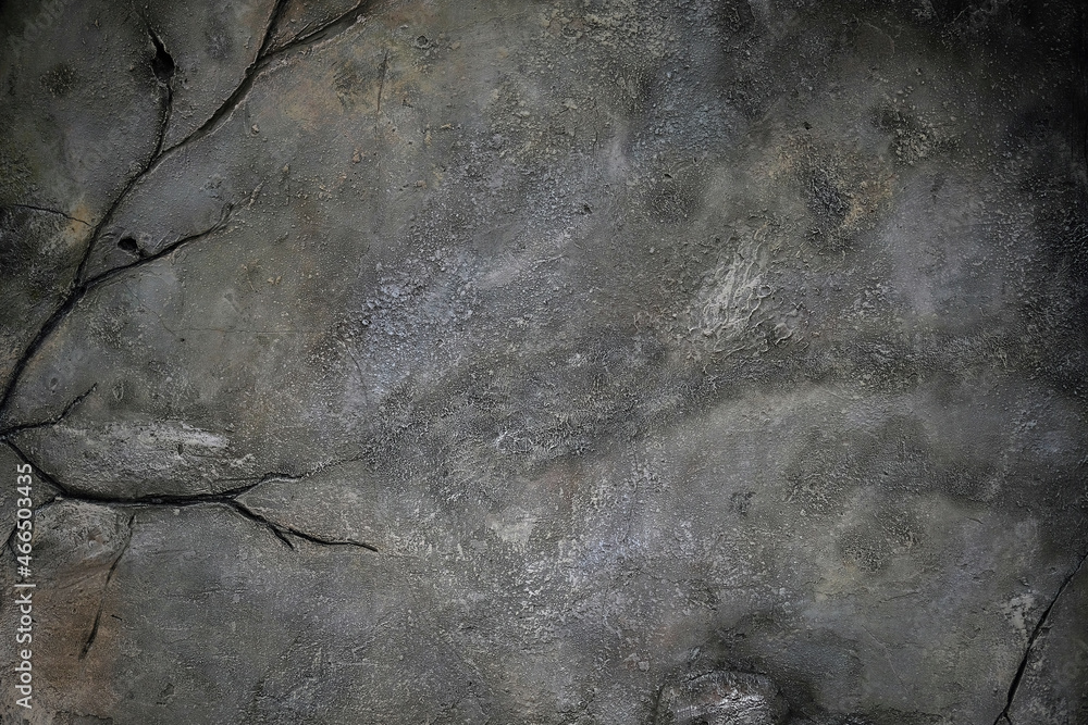 Fototapeta premium Grunge cement wall texture. Gray wall with cracks background. Scary gray background for Halloween. Abstract grunge stucco texture. Cracked surface of plaster.