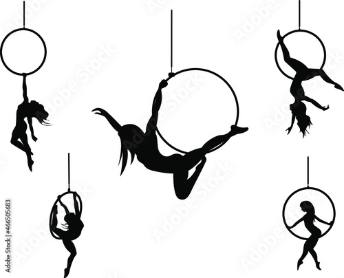 Silhouettes of aerial hoop and aerial silks performers and pole dancer isolated on a white background. Aerialists. Air gymnastics. Gymnasts.Black and white illustration of a woman dancer