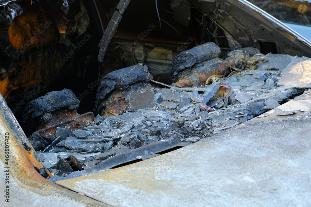 Melted head restraints and rear window of burned out car. Melted head restraints and rear window of burned out car.