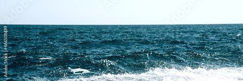 Deep blue ocean water and blue sky background. Horizon of the sea. Banner