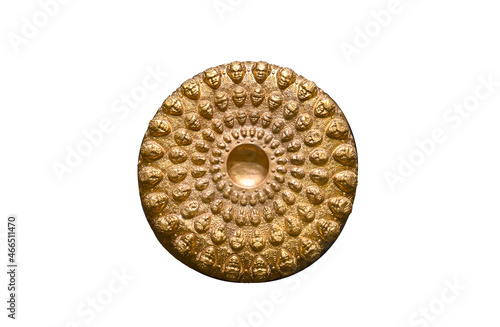 Fotografi Replica of gold Phiale (libation bowl) embossed with 72 heads isolated on white background