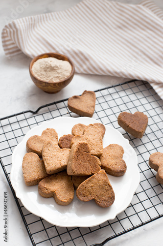 homemade heart-shaped cookies cool on the grill, valentine's day gift with love, gluten-free buckwheat flour pastries.