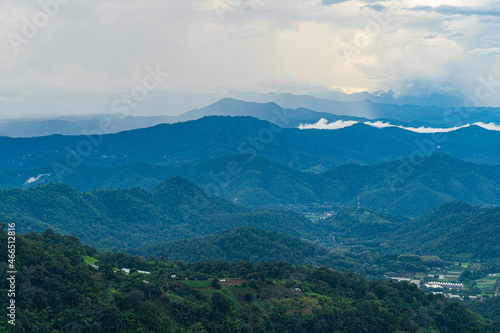 Mountains range in northern Thailand in the rainy season where the rain is falling into the forest.