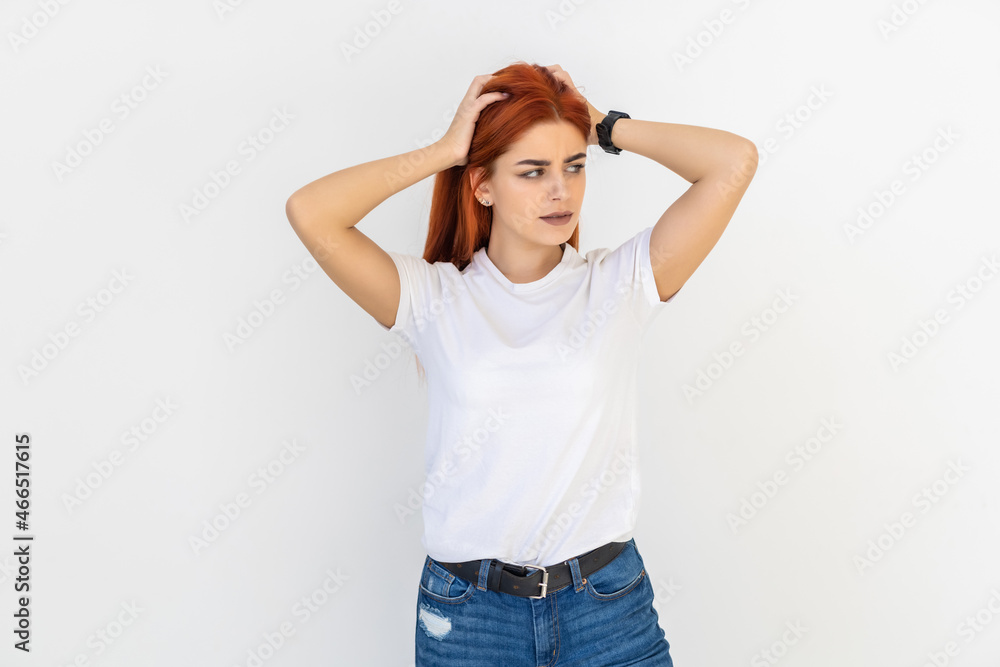 Beautiful modern redhead woman playing with ginger hair on white background Beautiful modern redhead woman playing with ginger hair on white background